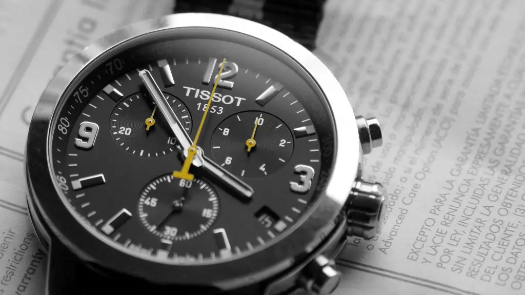 Tissot chronograph watch sat on paper