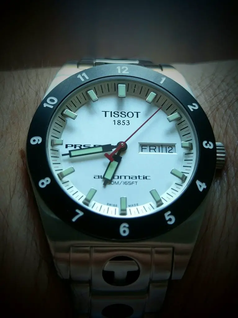 Tissot dive watch worn on a wrist